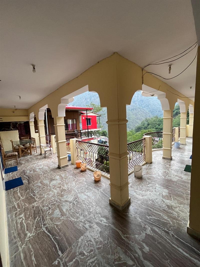 Arched veranda framing views of the surrounding hills